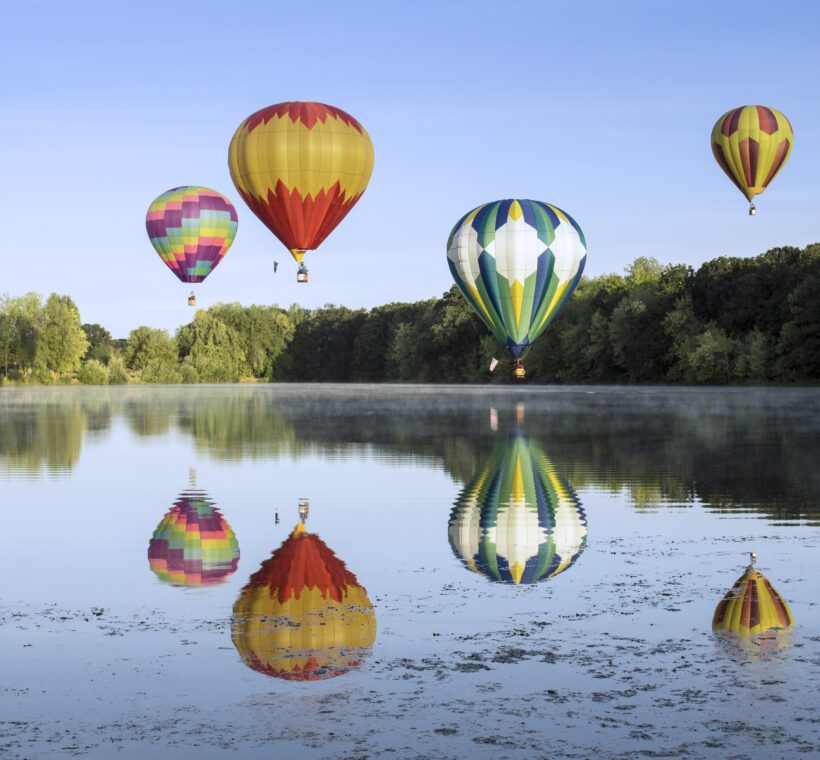 Are there camping experiences that include hot air balloon rides in Maasai Mara?